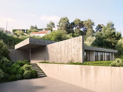 casa de concreto integrada à natureza